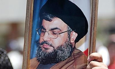 תמונתו של נסראללה נישאת בהפגנה