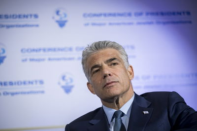 לפיד: שלמו כסף והתפקדו אך בלי להשפיע