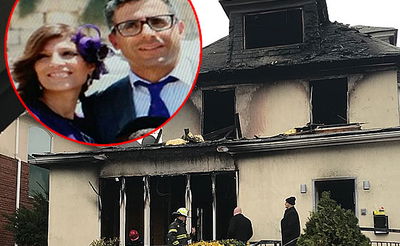 יוסי ורעייתו ע"ה על רקע הבית השרוף