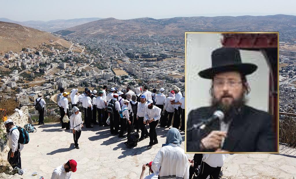 הרב לדרמן על רקע סיור של האגודה