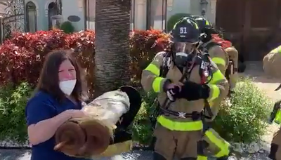 הכבאים חילצו ספר תורה; האישה התרגשה