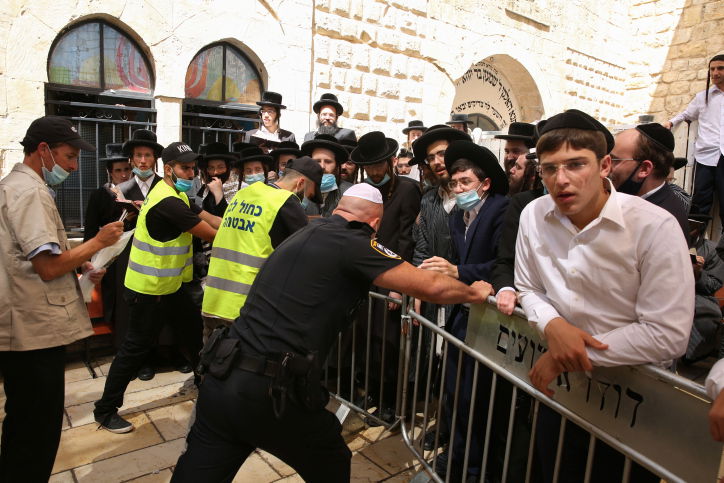מהומה במירון: המתפללים פרצו לתוך הציון
