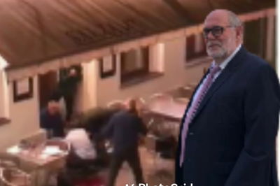 ברנהולץ על רקע המסעדה סמוך לאירוע