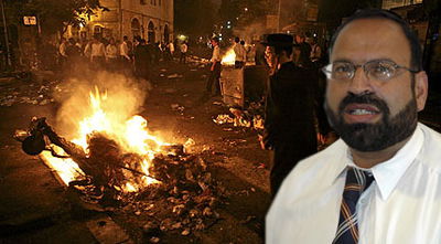 שמואל יצחקי על רקע המהומות (פלאש 90)