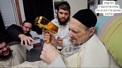 עם אקדח דולרים: תיעוד שמחת ליל פורים במחיצת המקובל 