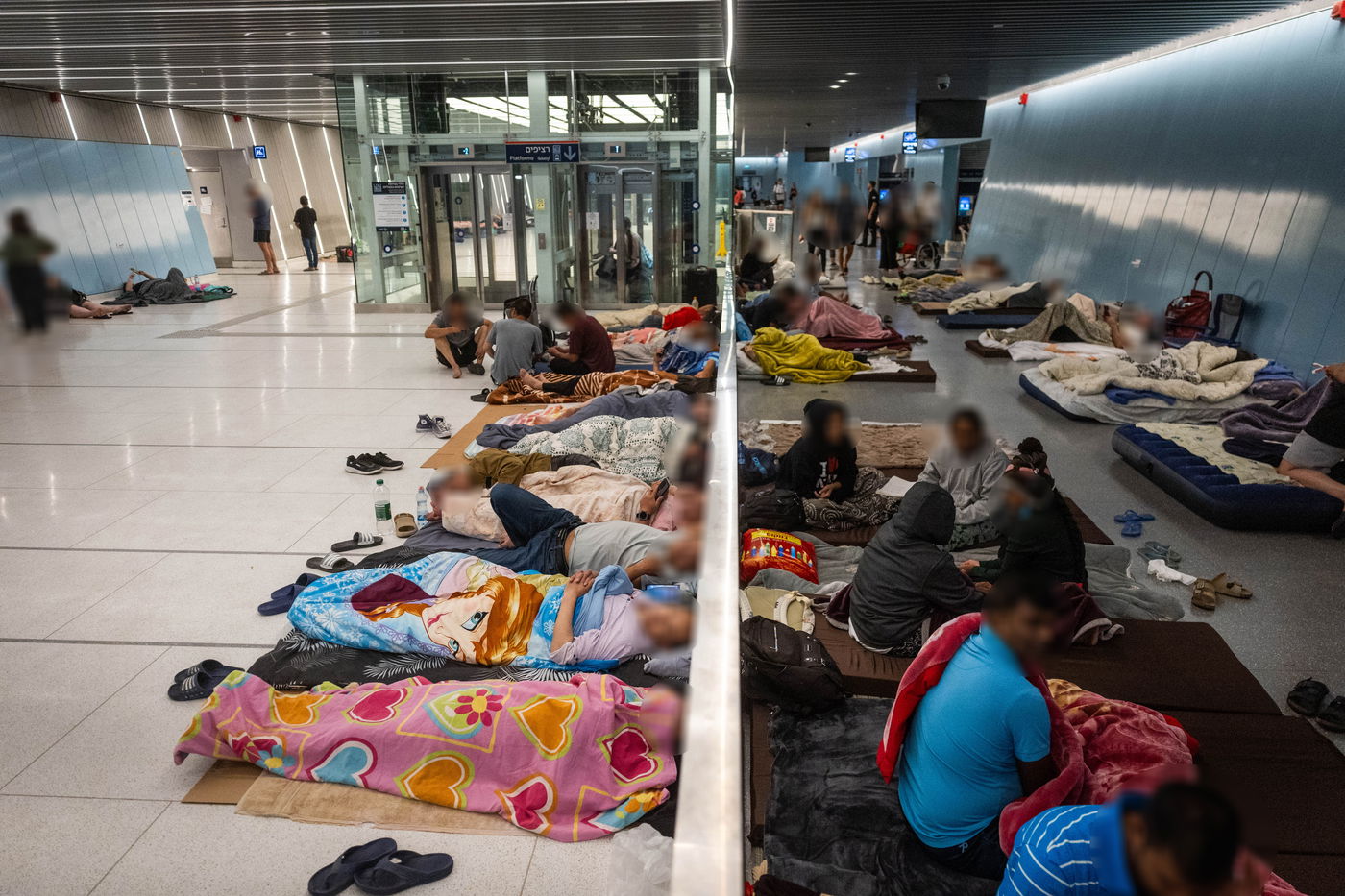 אזרחים תופסים מחסה לילי בתחנת הרכבת הקלה בתל אביב