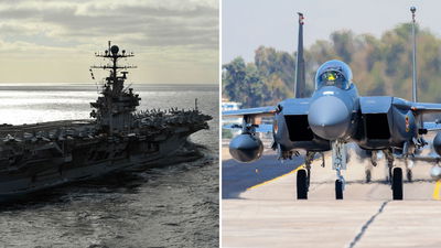 מטוסי קרב מסוג F-15 מימין, נושאת המטוסים אברהם לינקולן משמאל